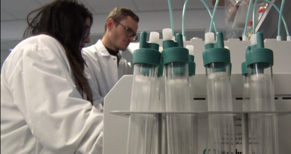 Researchers working with human milk laboratory equipment