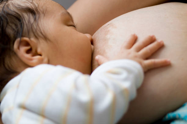 Mother nursing baby